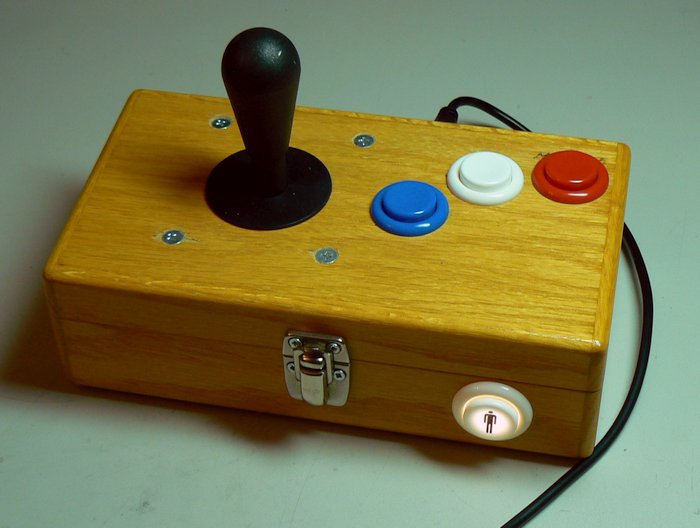 Arcade stick with IL
      Eurostyle joystick and IL PSL-H buttons. J-ACE arcade controls
      encoder and illuminated start button.